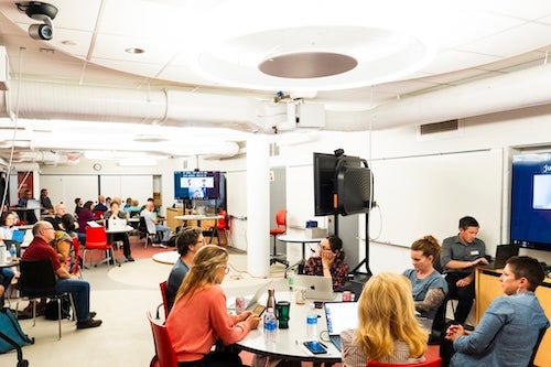 people collaborating at tables