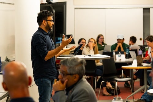 Man talking to a room full of people