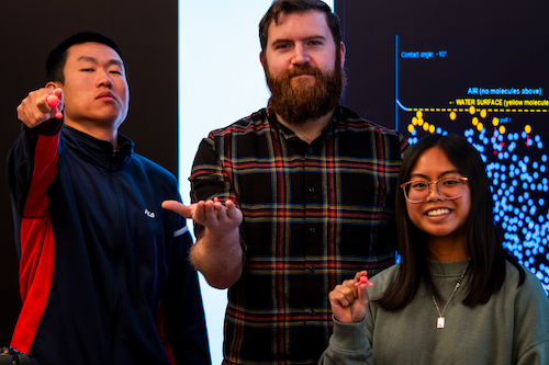 students showing 3D printed items from an experiential learning exercise