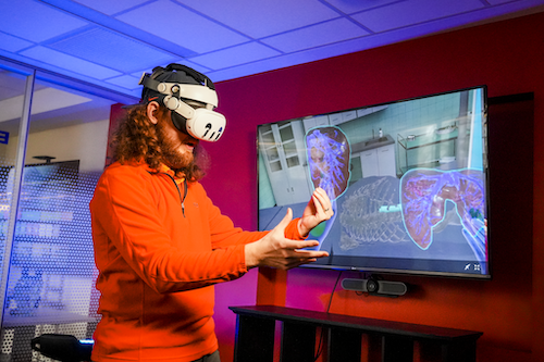 a man wearing a vr headset doing a virtual lab test