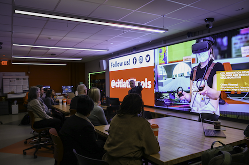 a man doing a presentation to a classroom