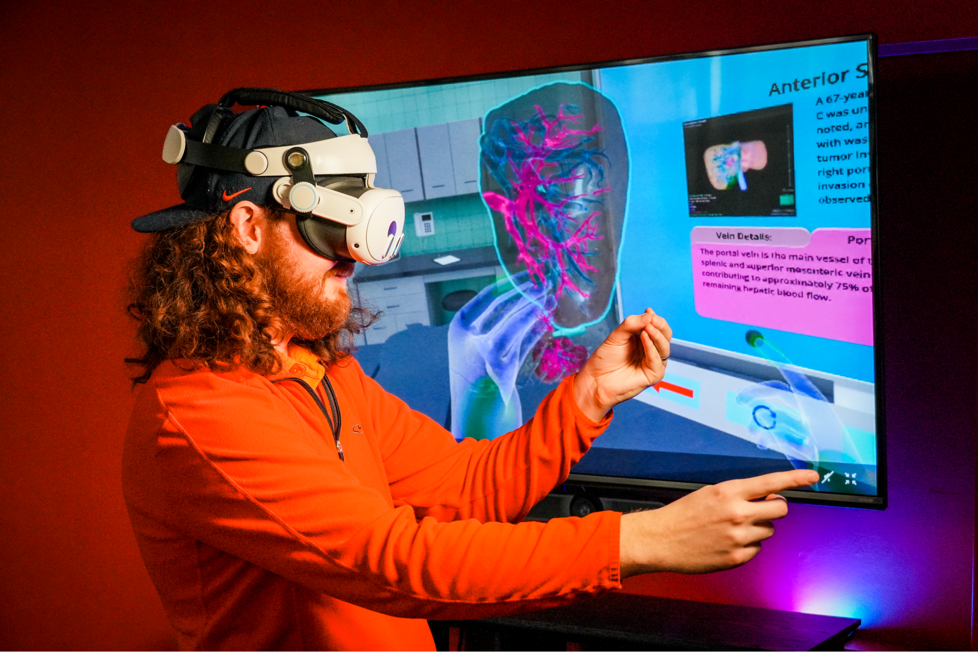 Photo of CITL VR Developer Alex Dill demonstrating how to position a transluscent liver in VR