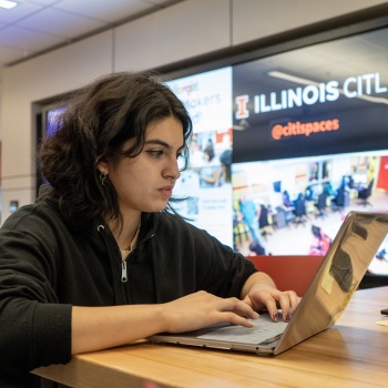 student working at a laptop