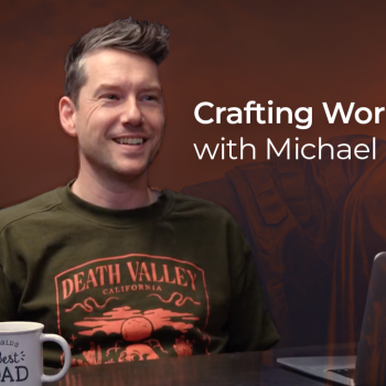 Michael Curtain sits with a coffee cup at a table