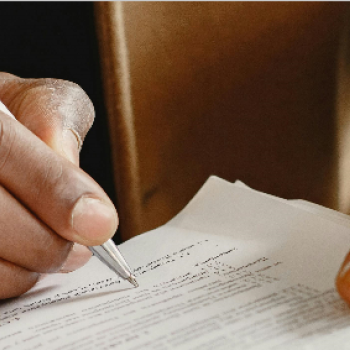 Student filling out evaluation form