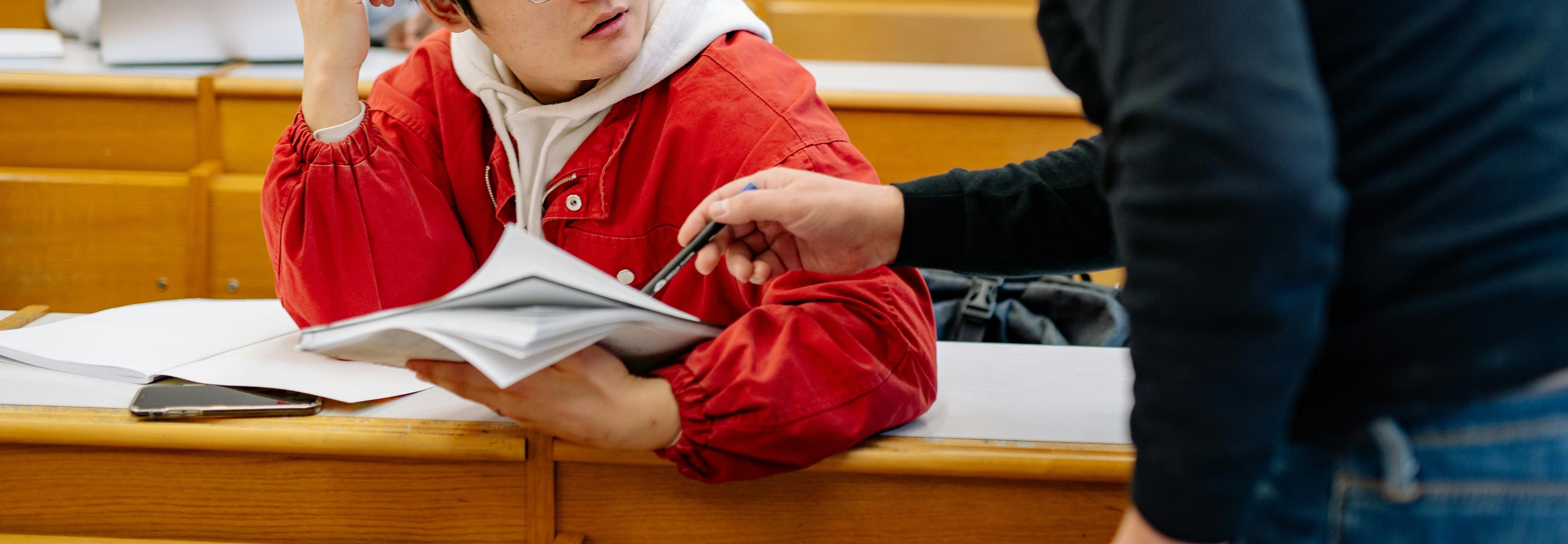 instructor helping student