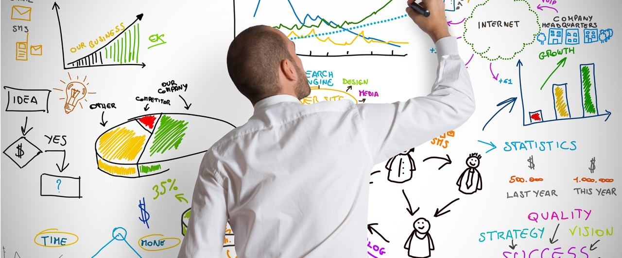 Man writing on Dry-Erase board