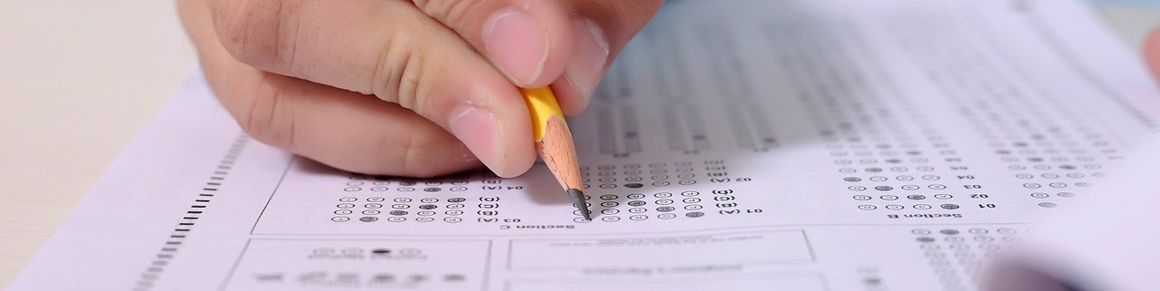 Close-up of pencil filling out scantron