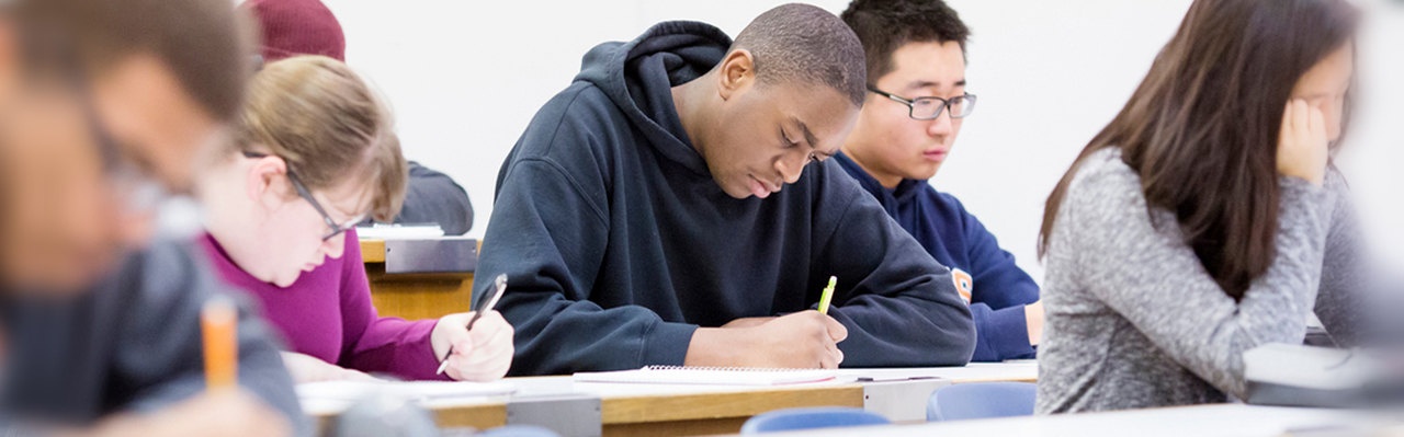 Students at desks taking an exam